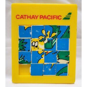 Vintage Cathay Pacific Yellow Sliding Puzzle Cartoon Graphic Collectible Toy